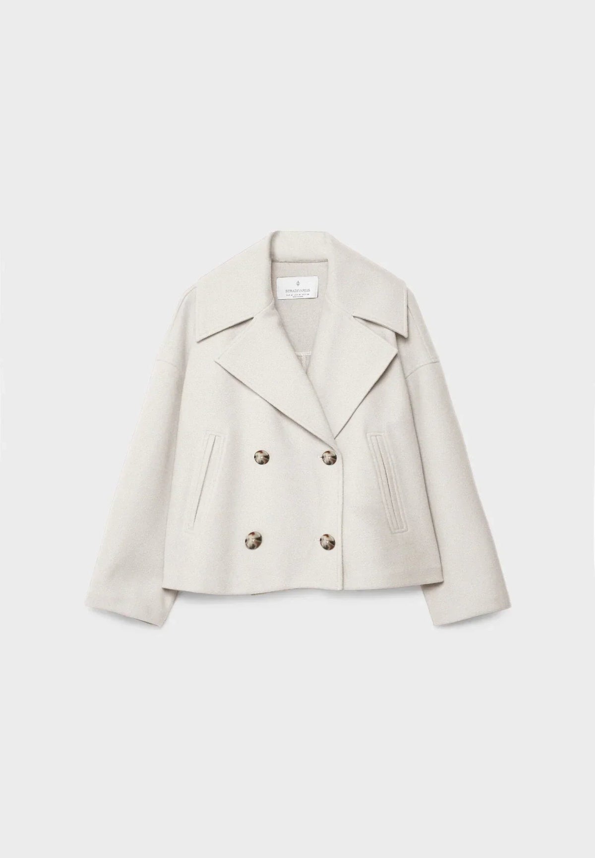 Dames Korte Jas met Dubbele Knoopsluiting en Oversized Revers Beige
