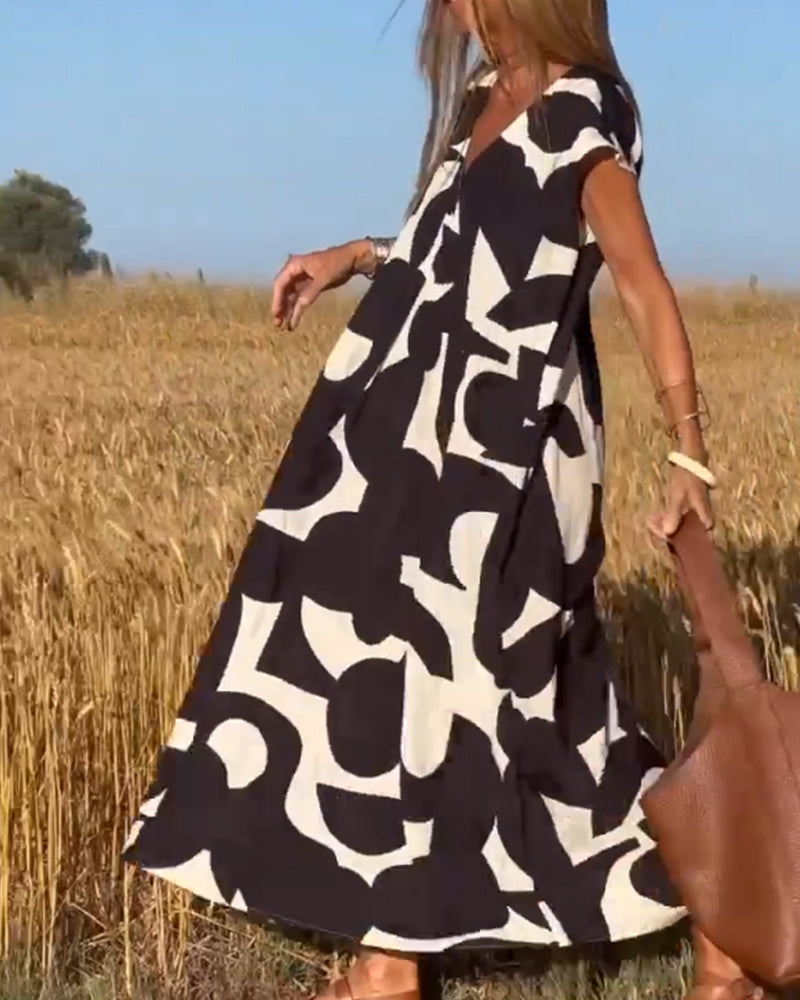 Dames Maxi Jurk met V-hals en Abstract Print Korte Mouw