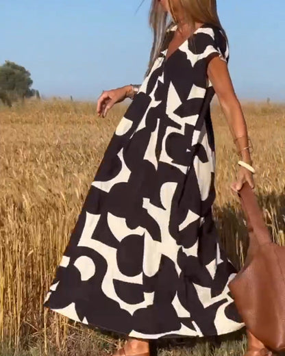 Dames Maxi Jurk met V-hals en Abstract Print Korte Mouw